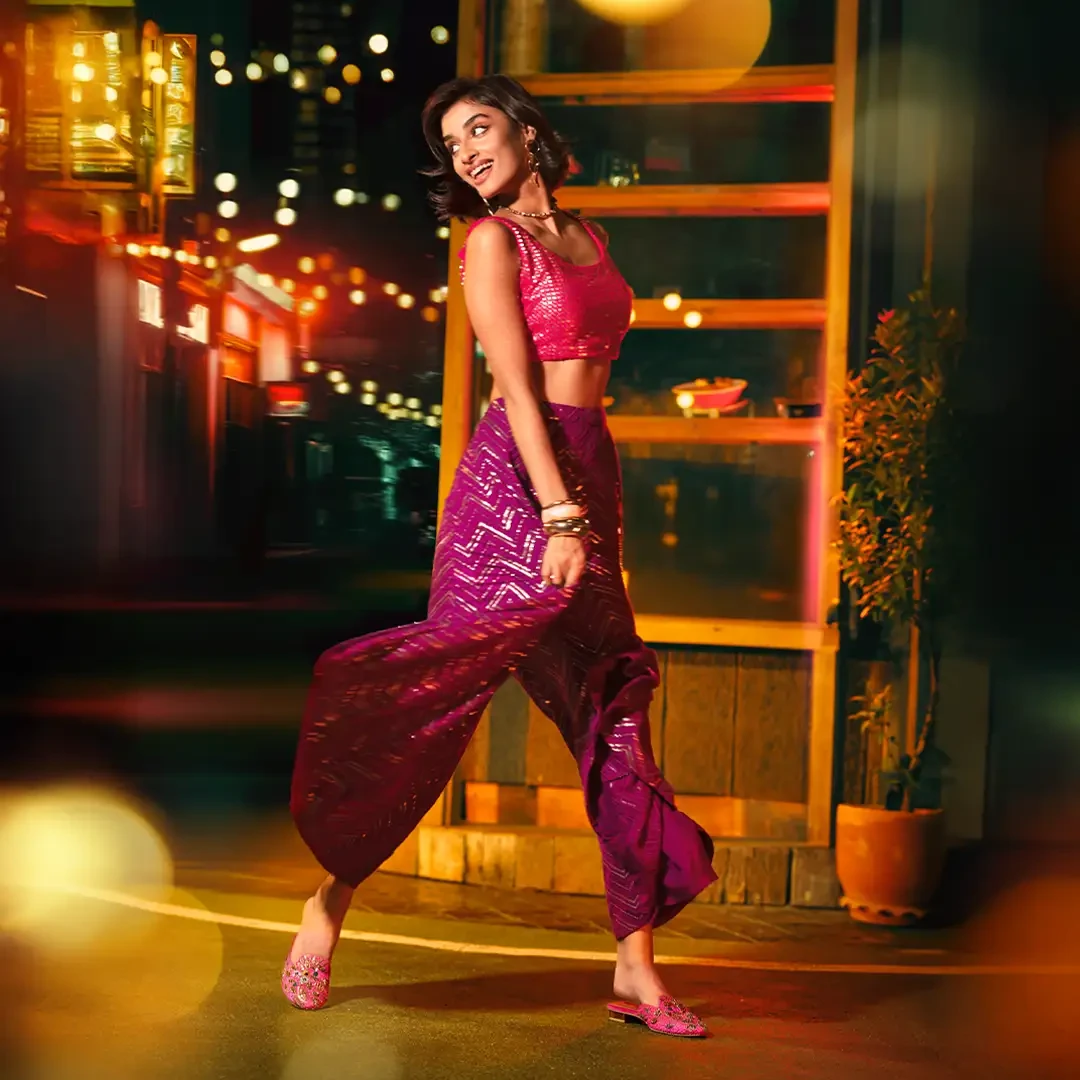 Man standing in water, wearing dark brown shoes